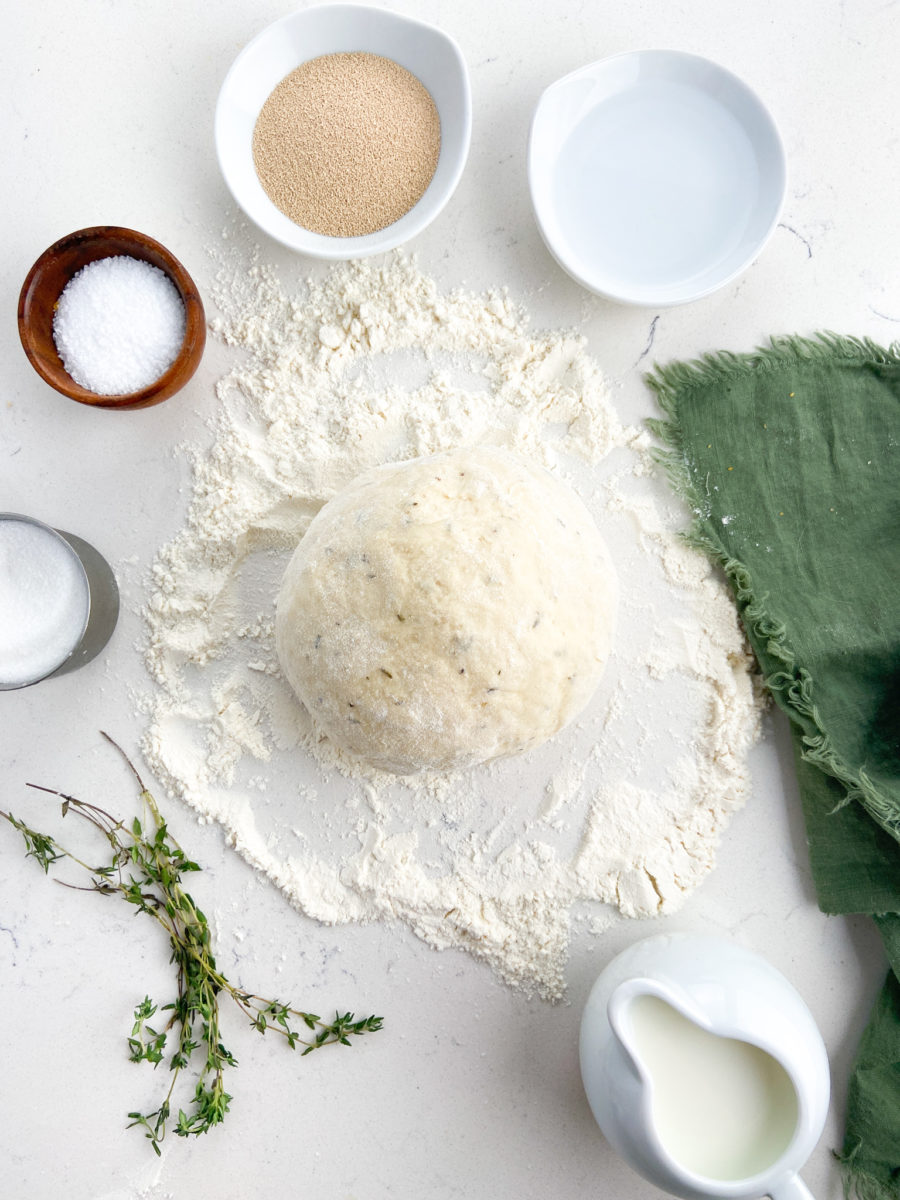 Dough ball on floured surface. 